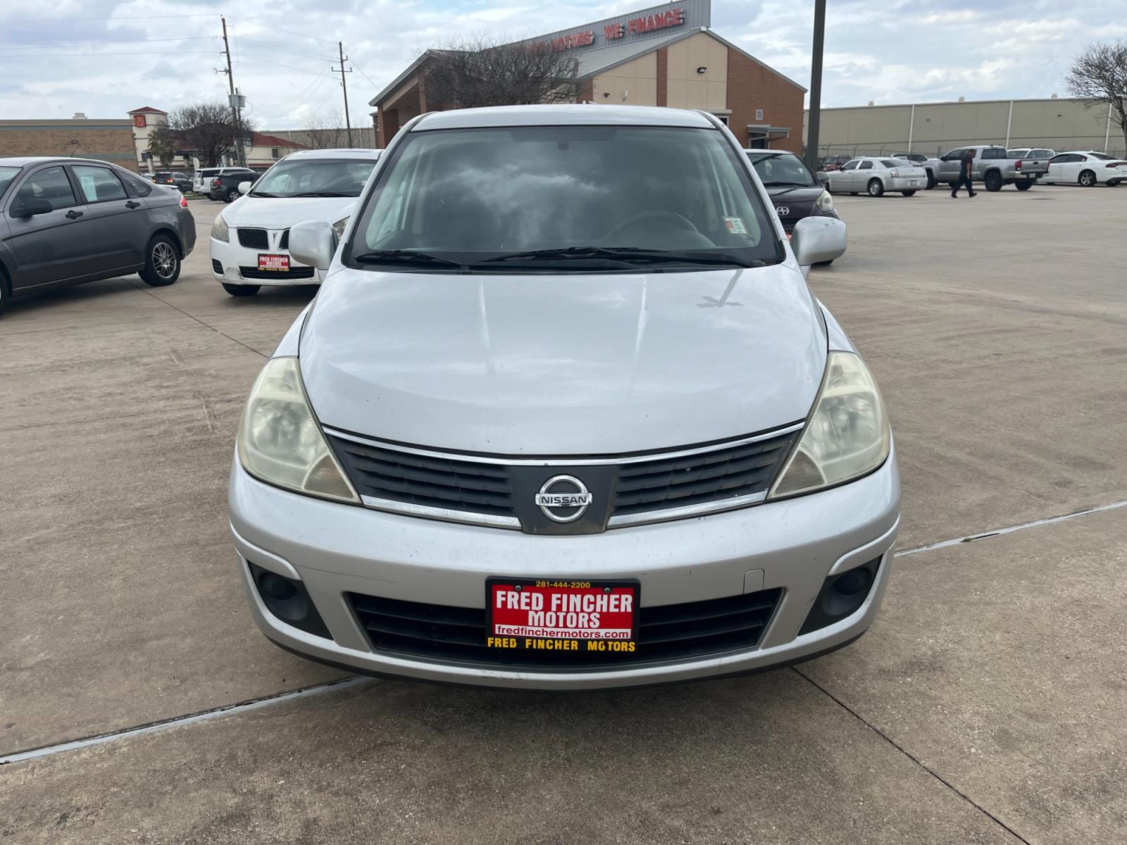 2009 SILVER /black Nissan Versa 1.8 S Hatchback (3N1BC13E09L) with an 1.8L L4 DOHC 16V engine, Manual transmission, located at 14700 Tomball Parkway 249, Houston, TX, 77086, (281) 444-2200, 29.928619, -95.504074 - Photo #1